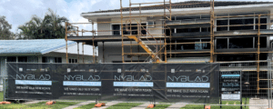 building site with scaffolding with Nyblad Construction branding