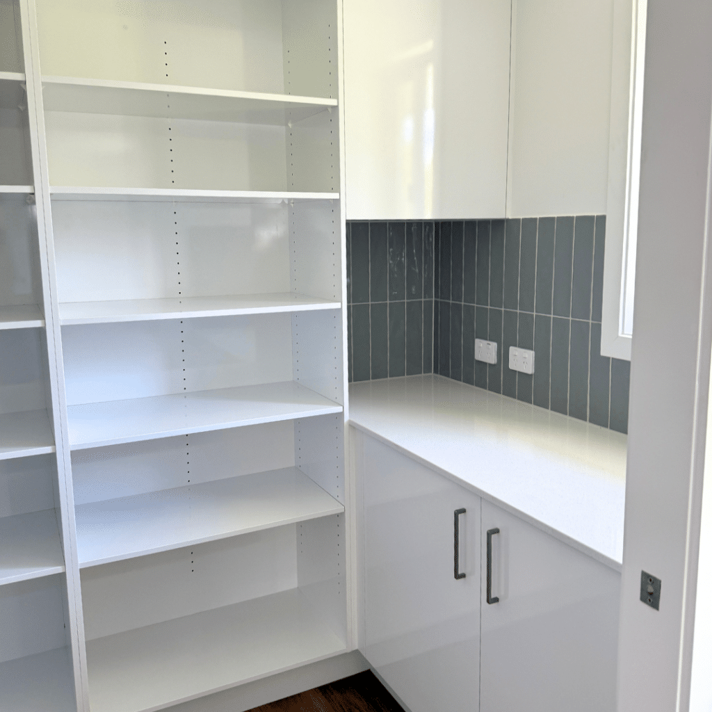 Butler's Pantry with white open cabinetry and blue-grey splash back tiles